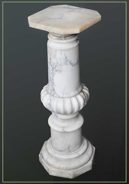 white marble pedestal shaped top