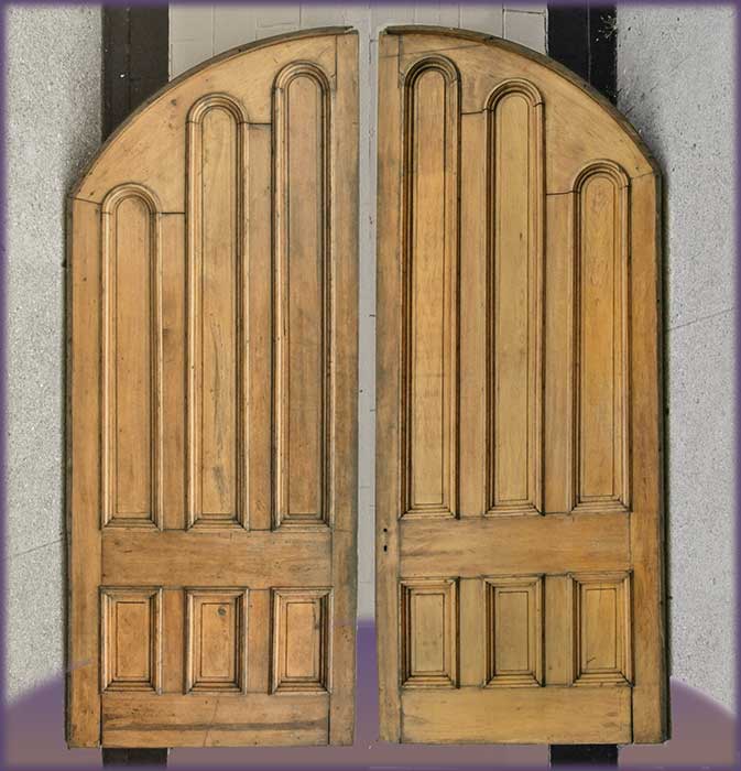 Arched white walnut doors