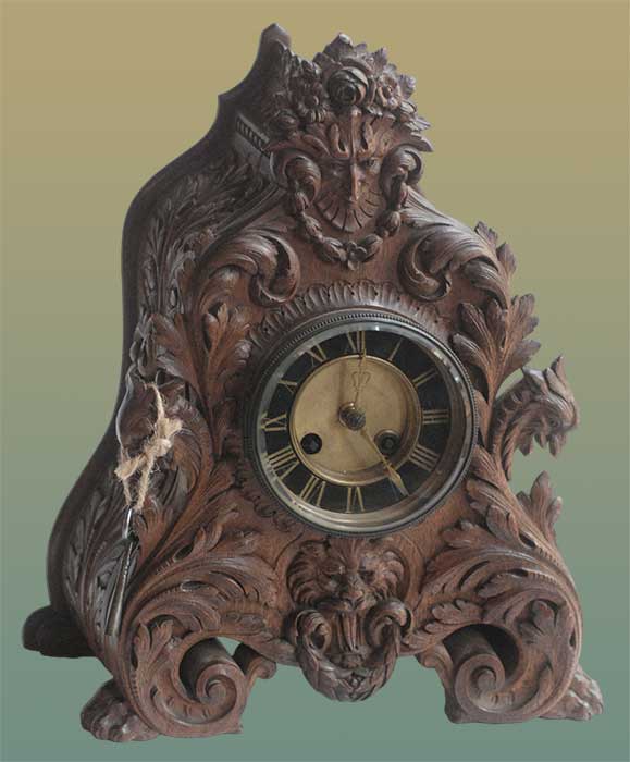 carved clock with mythical face