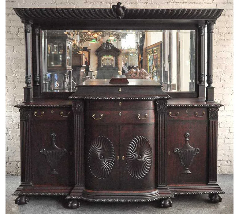 artfully carved mahogany sideboard