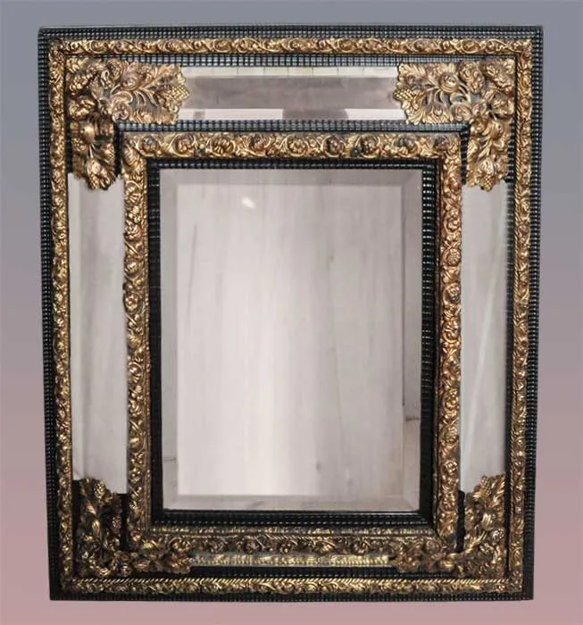 filigreed mirror with beveled glass