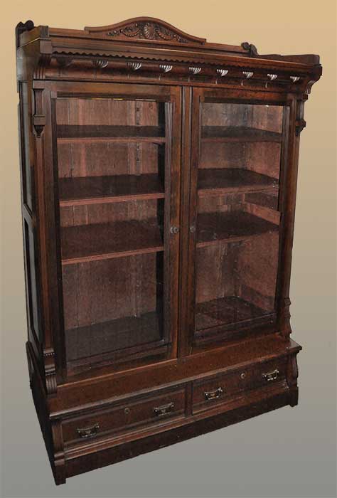 carved cherry two-door bookcase