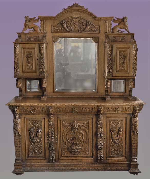 large carved fantasy side board with mythical faces