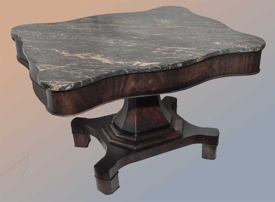 shaped classical mahogany table with marble top