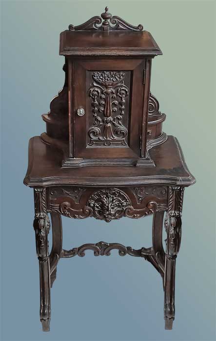 ornately carved phone desk