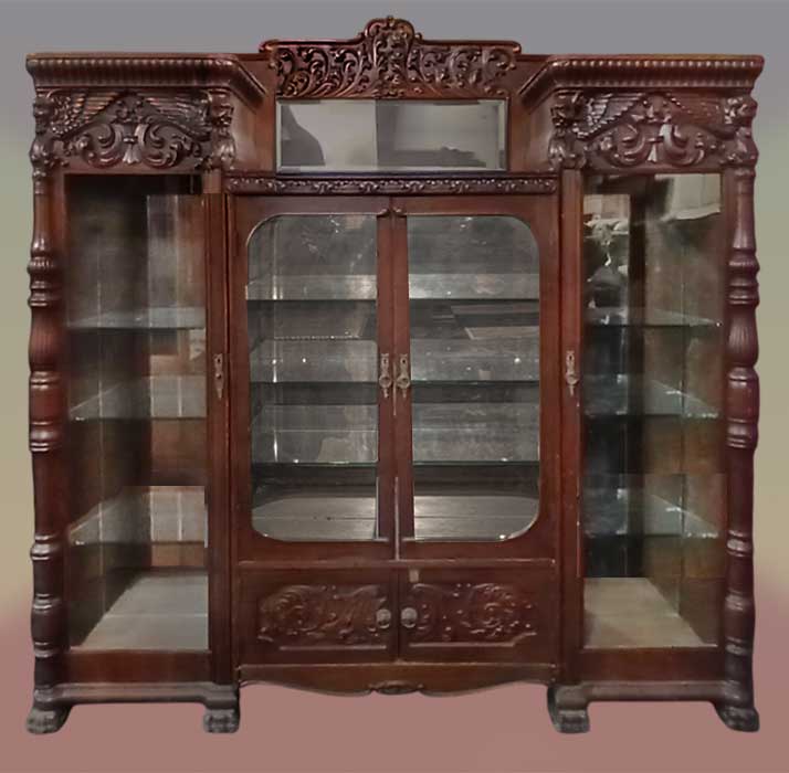 four-door ornately carved display cabinet showcase