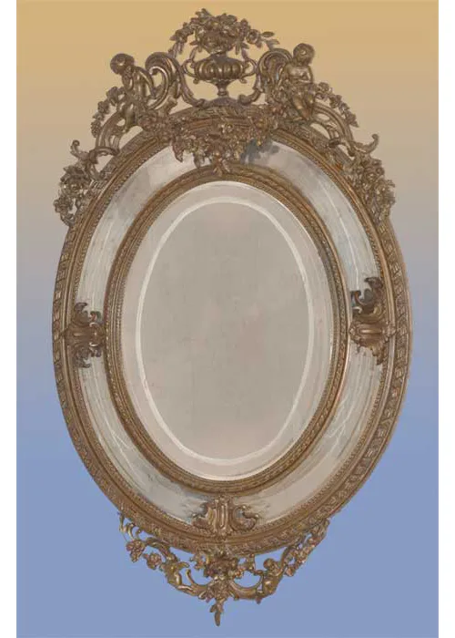 ornate oval mirror with cherubs