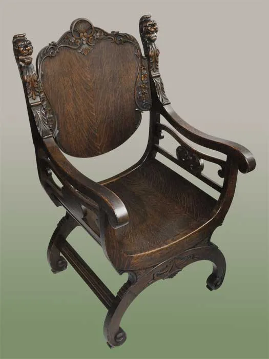 shaped oak chair with lion heads