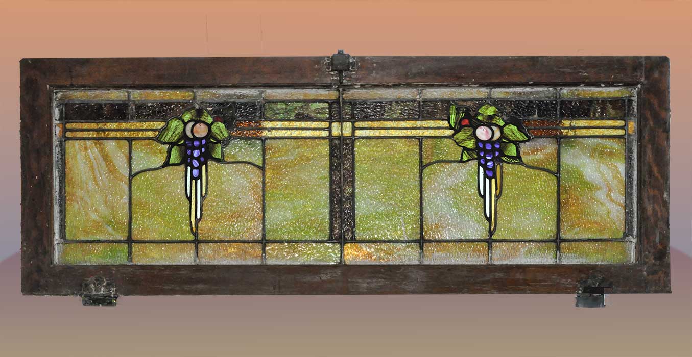 transom window with grape clusters