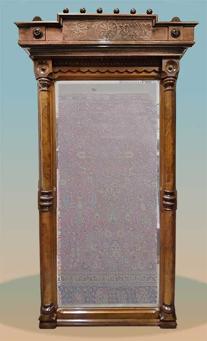 carved decorative mirror with beveled glass
