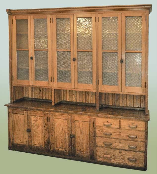 large pine step-back cabinet with textured glass doors