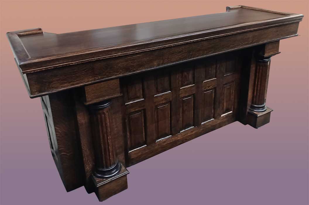 small carved oak home bar