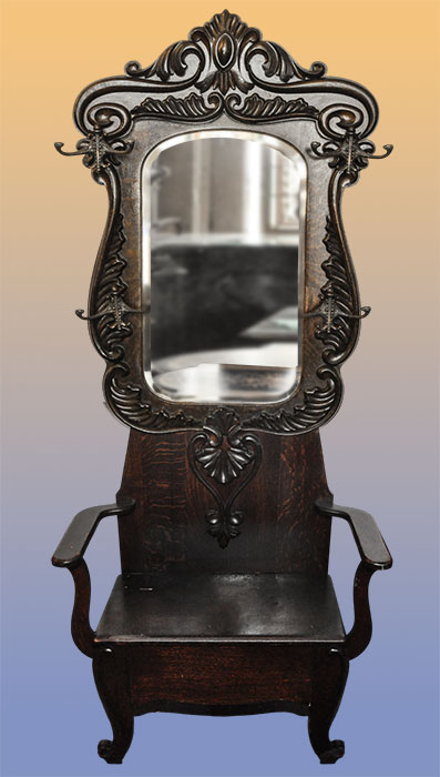 deeply carved oak hall tree