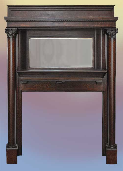 carved full oak mantel with columns and mirror